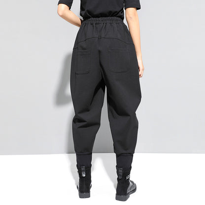Tapered foot pants with zipper stitching pockets